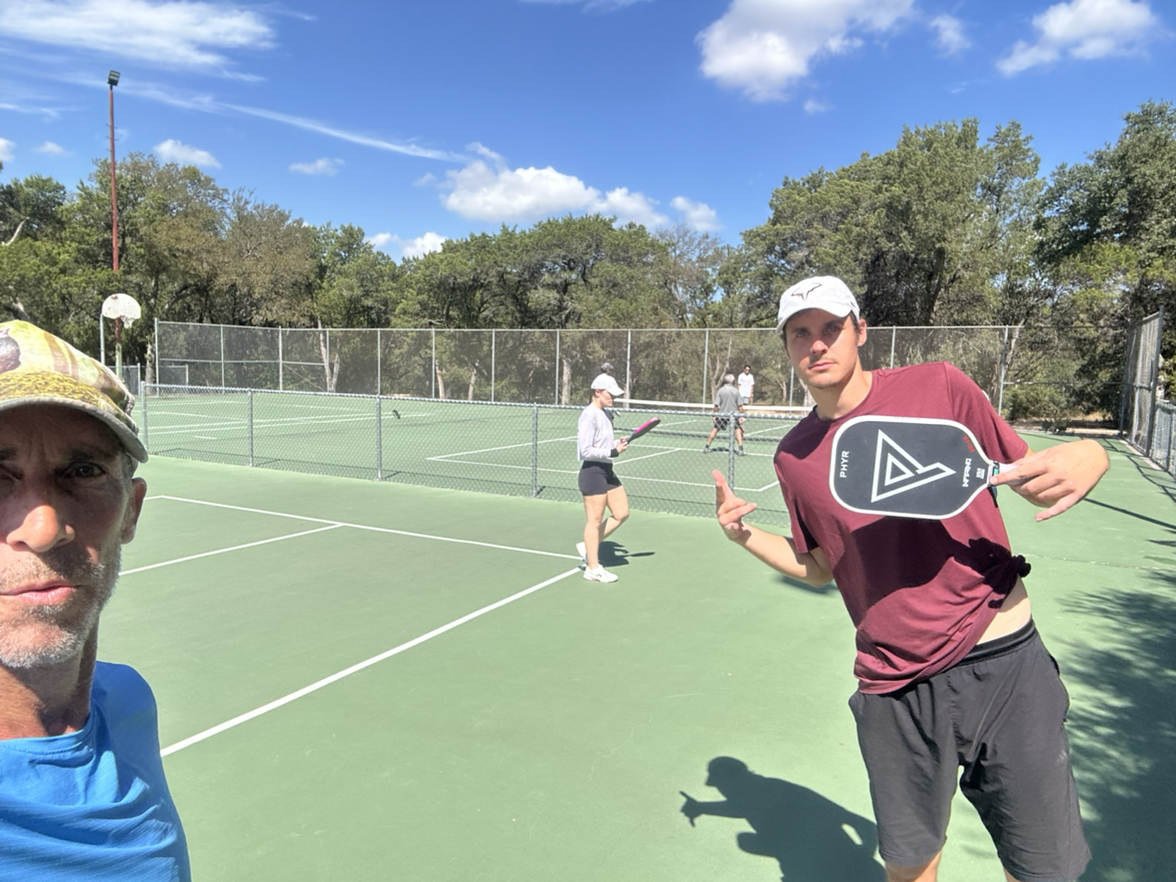 Austin pickleball coach John Lamm running a lesson on an outdoor court